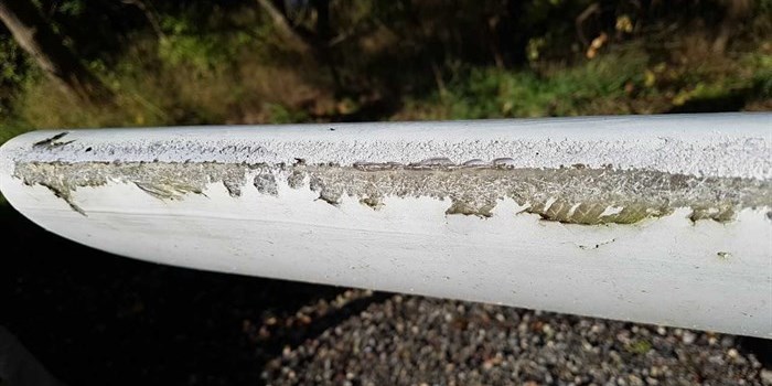 A wind turbine blade exposed for erosion